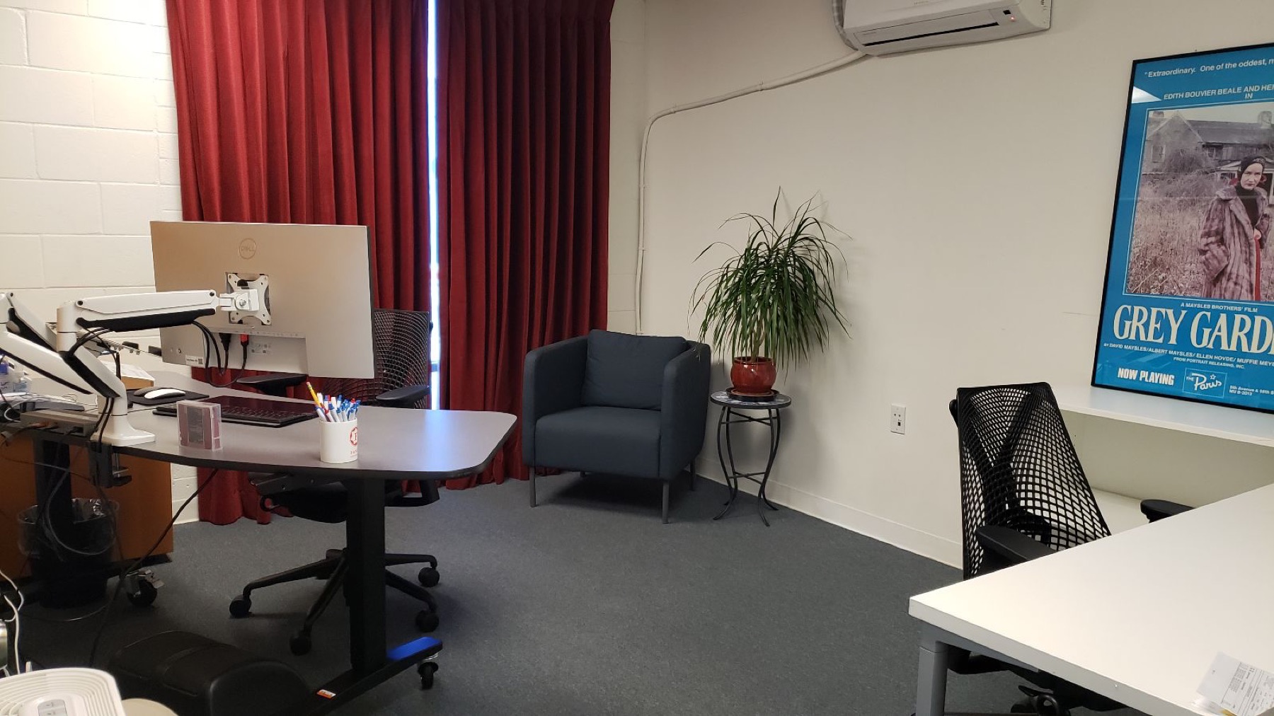 Fancy West office room with desks and wall art