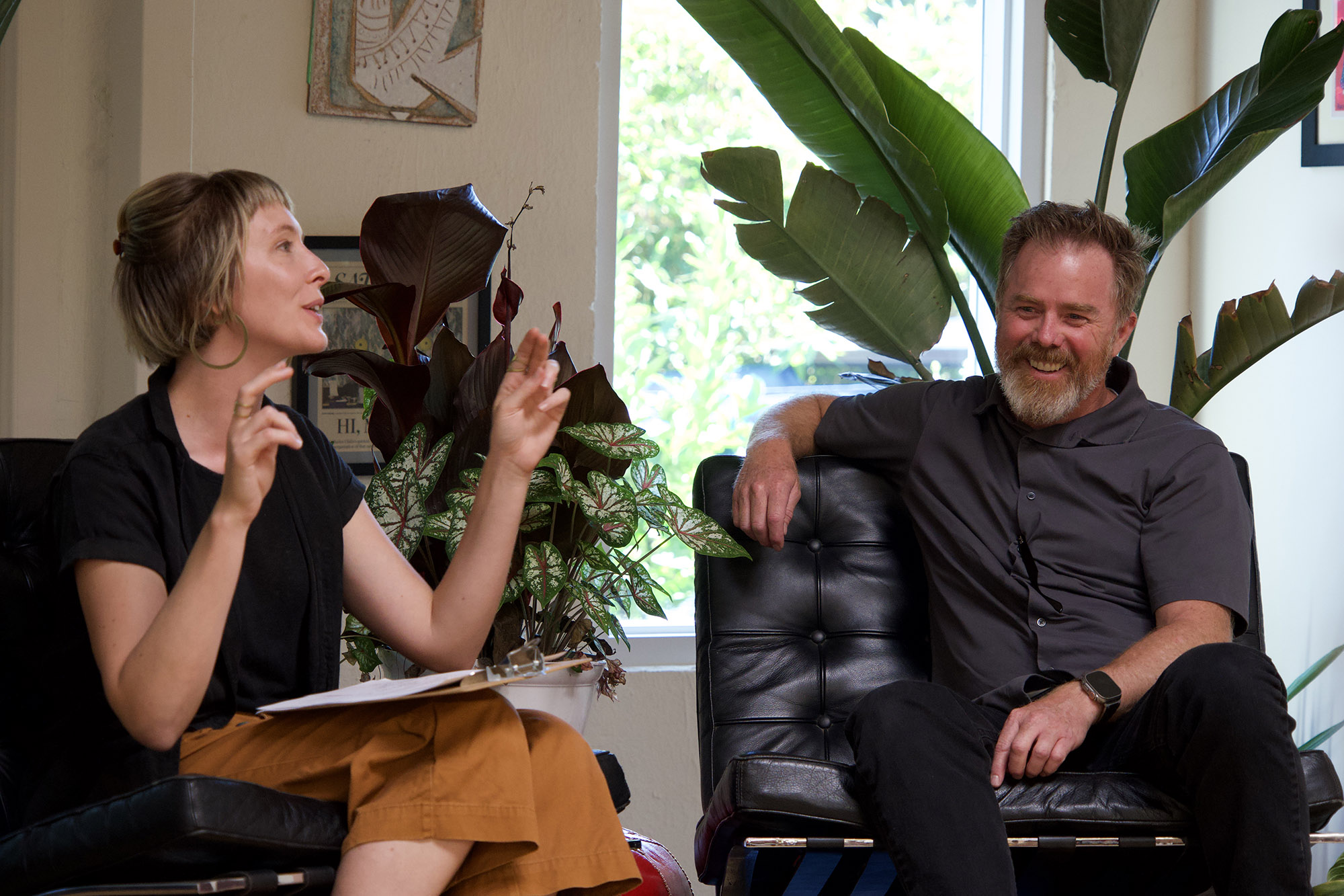 Two speakers in conversation at a One Hour Process event
