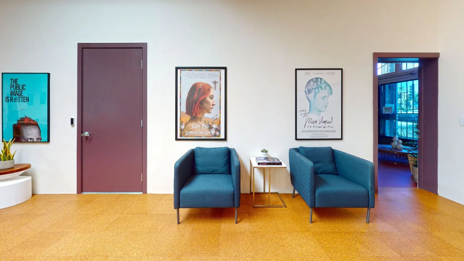 Seating and framed film artwork in the Fancy Film atrium